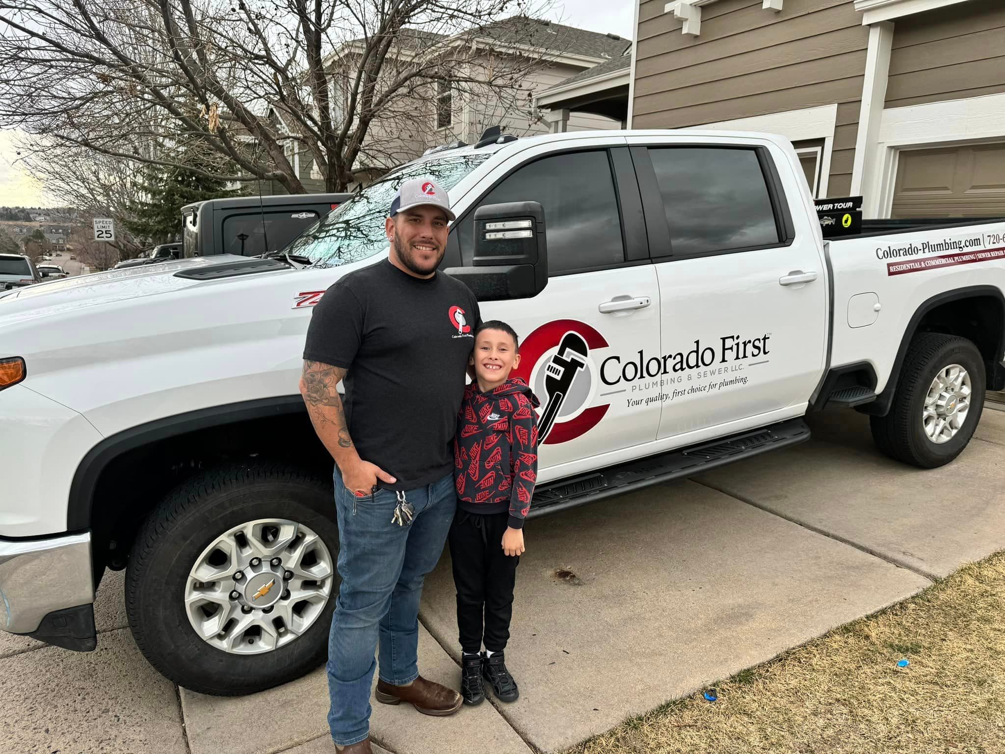 Codee and his son with the work truck