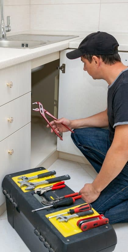 Under-sink plumbing work by Bennett Plumbing, Heating & Air