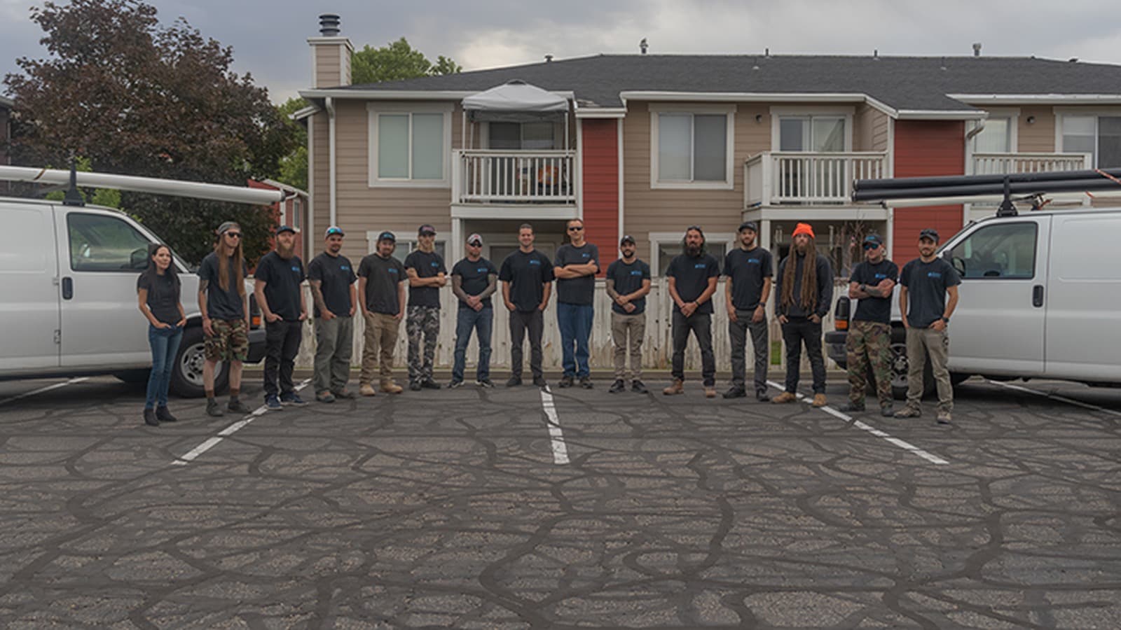 Keemer Plumbing shop crew between company vans