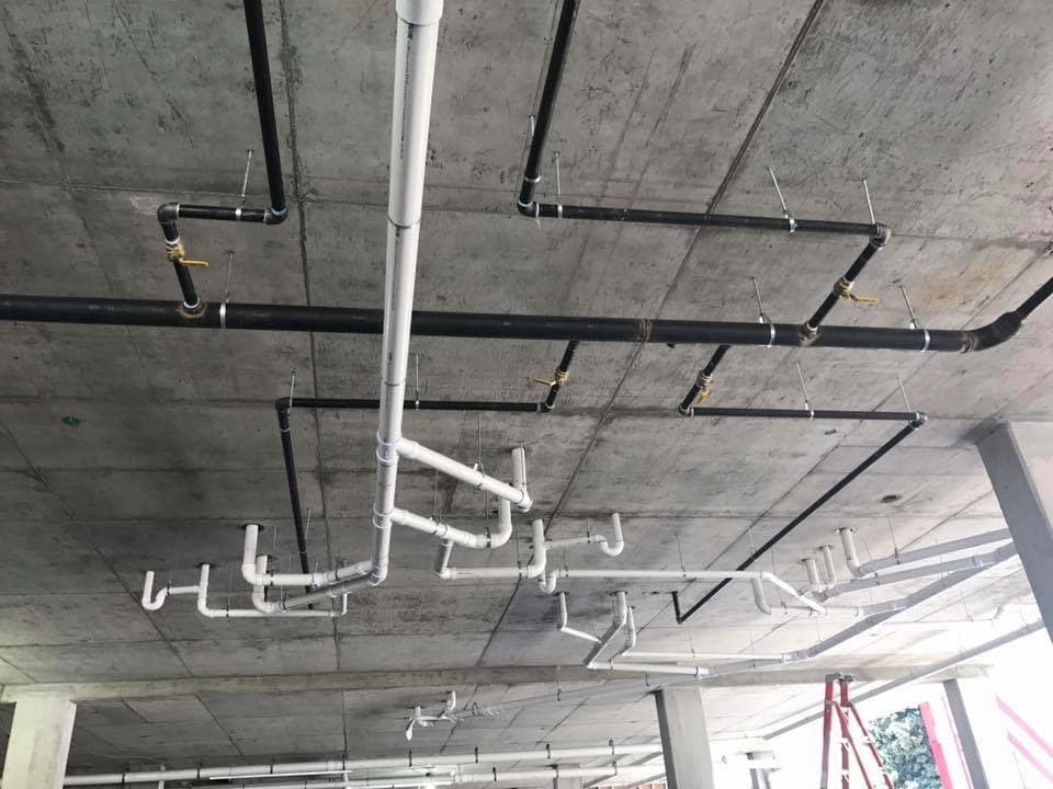 Podium underslab piping at Stapleton